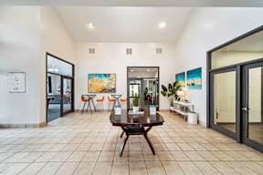 A spacious living room with a wooden coffee table in the center.