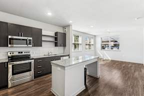 Modern kitchen dark wood cabinets at Brandywine Green Apartments, Brandywine, MD, 20613