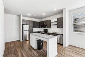 Kitchen with a white island at Brandywine Green Apartments, Brandywine, MD