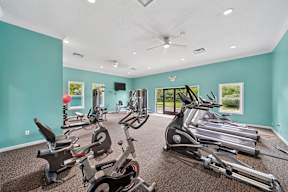 A spacious gym with a variety of exercise equipment.
