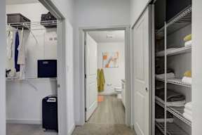A hallway with a towel hanging on the door.