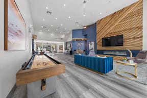 a game room with a pool table and a tv