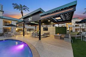 A poolside area with a bar and seating area.