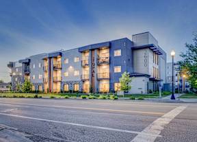 A modern apartment building with the number 2600 on the front.