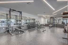 A fitness center with fitness equipment at The Opal apartments in Salt Lake County, Utah.