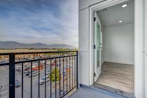 a balcony with a view of a parking lot
