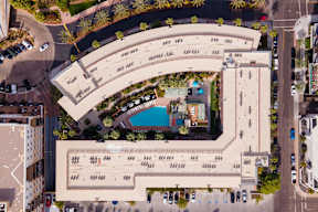 A large building with a pool in the middle of it.