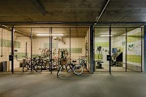 A bike is parked in a bike rack.