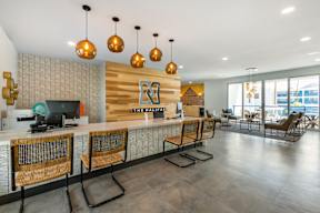 A reception area with a desk and chairs.
