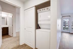 A white oven is built into a wall in a kitchen.