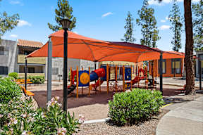2-Bedroom Apartments In Tempe, AZ - Villatree Apartments - Playground Covered By Shade With Sand And Benches