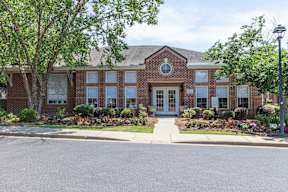 Clubhouse exterior brick beautiful landscaping  at Vista Commons Apartments, Columbia, SC