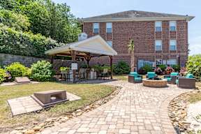 building exterior brick, pathway to firepit and pavillion  at Vista Commons Apartments, Columbia, SC