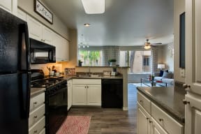 Kitchen with modern appliances and open concept floor plan in mesa az at Vista Grove Apartments, Mesa