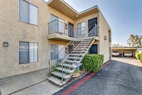 A building with a staircase leading to the second floor.