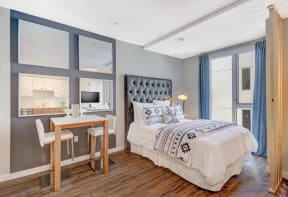a bedroom with a bed and a desk at L Seven, San Francisco, CA
