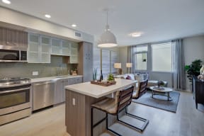 a kitchen and living room with a table and chairs at L Seven, CA 94103
