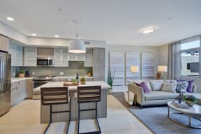 a living room with a kitchen and a couch at L Seven, San Francisco, CA
