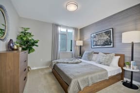 a bedroom with a bed and a dresser and a window at L Seven, San Francisco, 94103