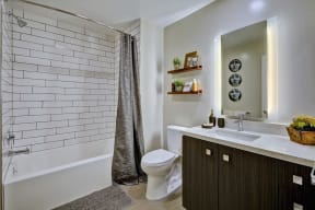 the residence on lamar apartment homes bathroom with toilet sink and shower at L Seven, CA 94103