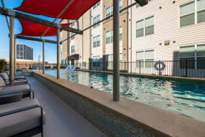 Sparkling Swimming pool and lounge chairs at Mockingbird Flats, Dallas, Texas