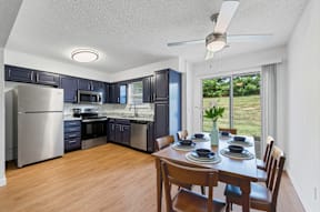 A kitchen with a dining table set for four.