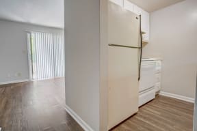 a kitchen with a refrigerator and a dishwasher