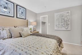 a bedroom with a bed and pictures on the wall at Madison Brookhaven, Georgia, 30329