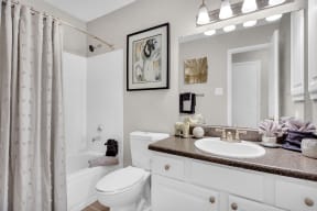 a bathroom with a sink and a toilet and a shower at Madison Brookhaven, Georgia, 30329