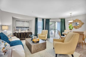 a living room with a couch and chairs and a table at Madison Brookhaven, Atlanta