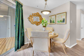a dining room with a table and chairs and a mirror on the wall at Madison Brookhaven, Atlanta, GA, 30329