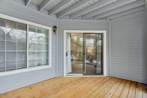 a room with a wooden floor and a glass door at Madison Brookhaven, Georgia, 30329