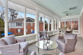 a living room with couches and chairs and a glass table at Madison Brookhaven, Georgia, 30329