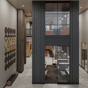 a rendering of a lobby with a staircase in the center and a lobby area in the background at Madison West Elm, Conshohocken