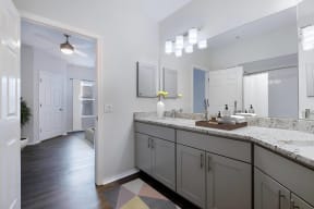 a bathroom with a large counter top and a large mirror
