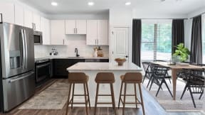 kitchen island and dining room at Elwood Apartments, Indian Trail, NC