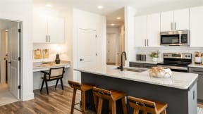 kitchen island and built in desk at Elwood Apartments, Indian Trail, 28079