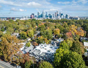 A view of a city skyline from a residential area.