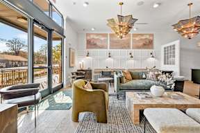 A living room with a green couch and a coffee table.