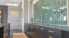 a kitchen with green and black chevron tile at The Fitzgerald, Spartanburg, SC, 29302