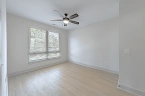 a bedroom with hardwood floors and a ceiling fan at The Fitzgerald, South Carolina, 29302