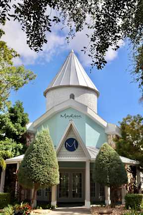 A white and blue building with a conical roof and the word "Mason" written on it.