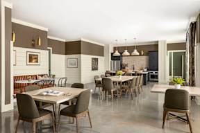 A dining room with a table set for six.