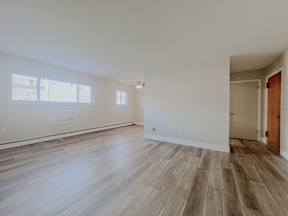 Living Room With Plenty Of Natural Light at Emerald Village Apartments, Willoughby, Ohio