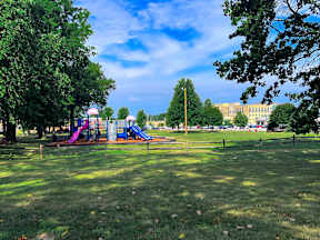 Playground with a slide and a purple slide at Emerald Village Apartments, Willoughby, OH, Ohio, 44094