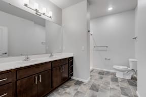 Spacious Bathroom Featuring A Dual Vanity