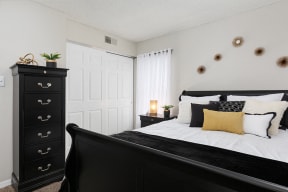 Bedroom with Sliding White Closet Doors
