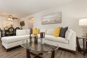 Spacious Living Room with Hardwood Style Flooring and White Trim