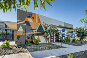 A modern building with a geometric design and the number 5900 on it.