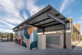 A modern building with a colorful mural on the side.